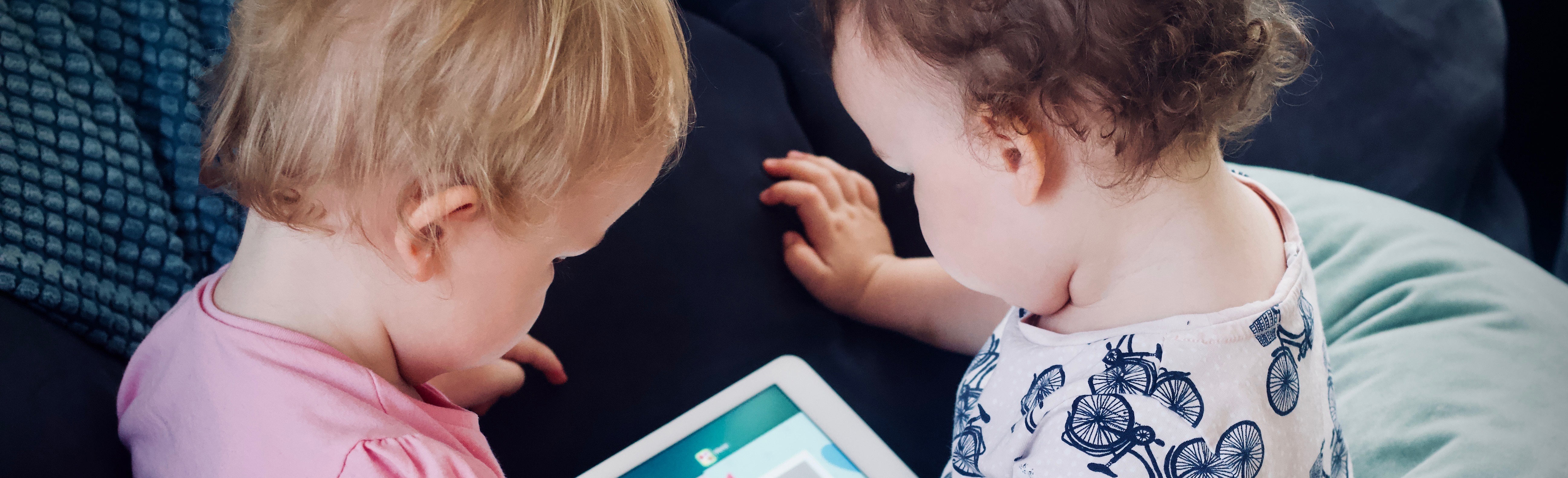 babies looking at ipad